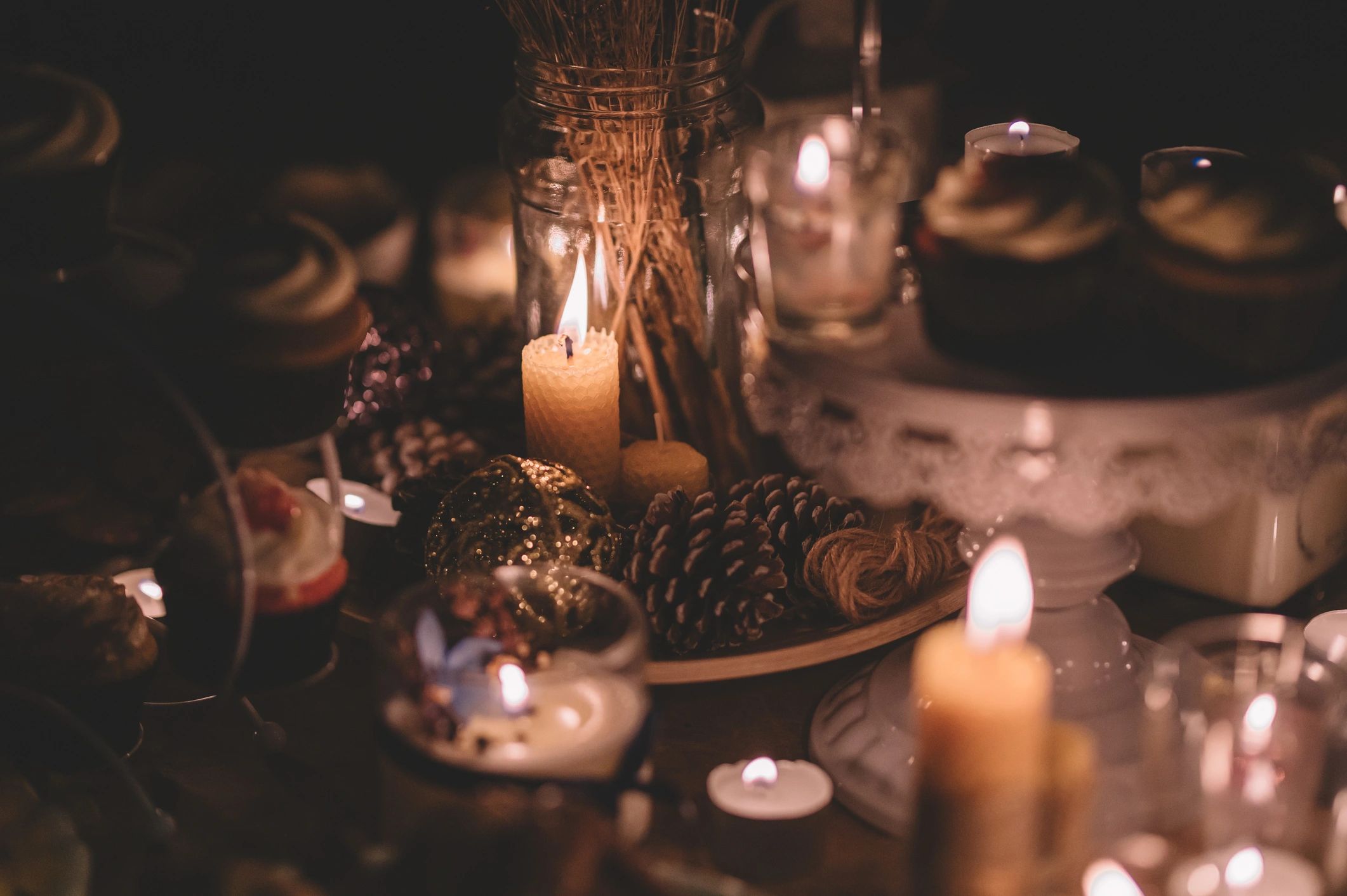 Candlelit table setting with seasonal decorations