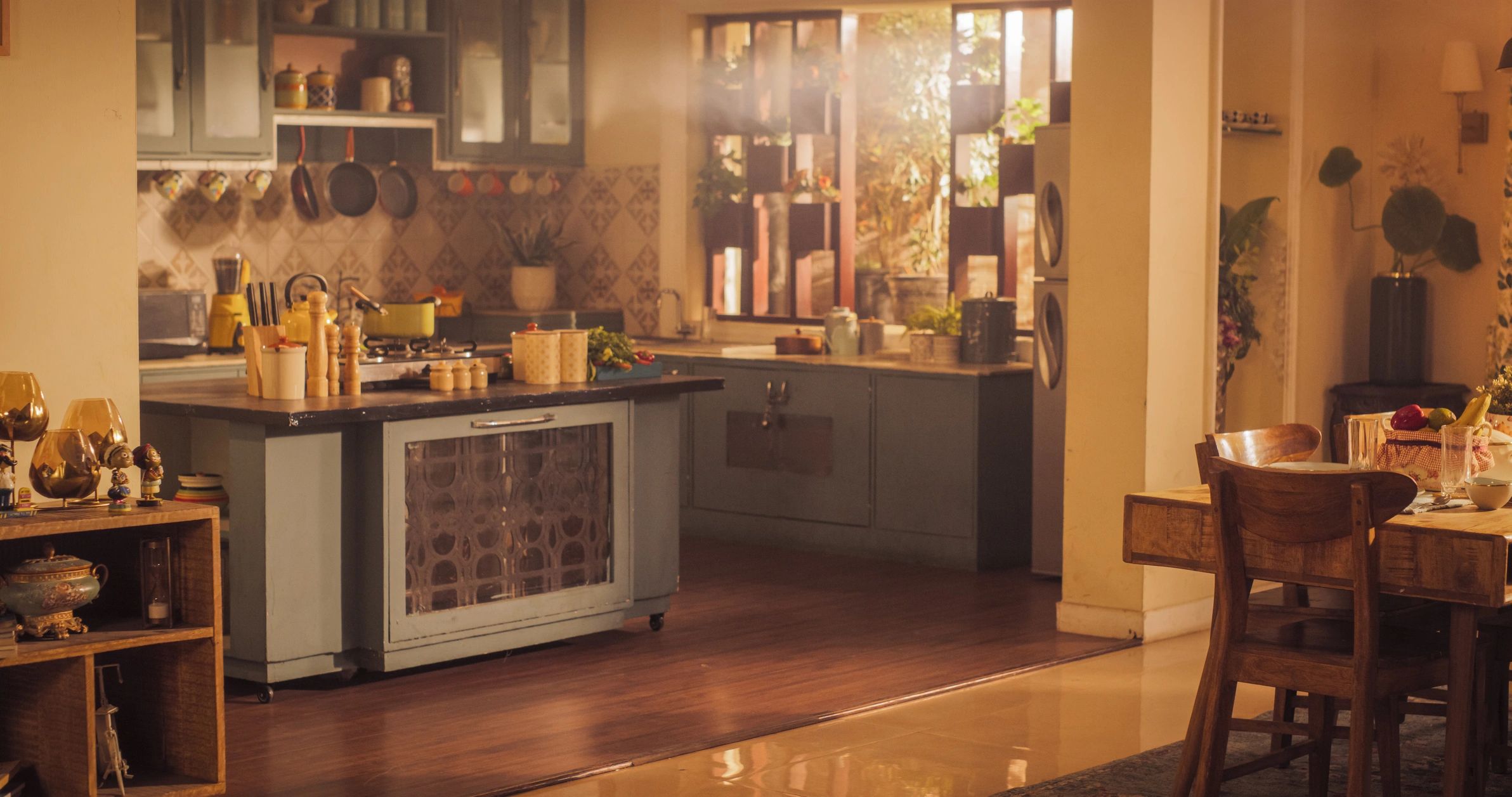 Warm cozy kitchen filled with utensils and sunlight