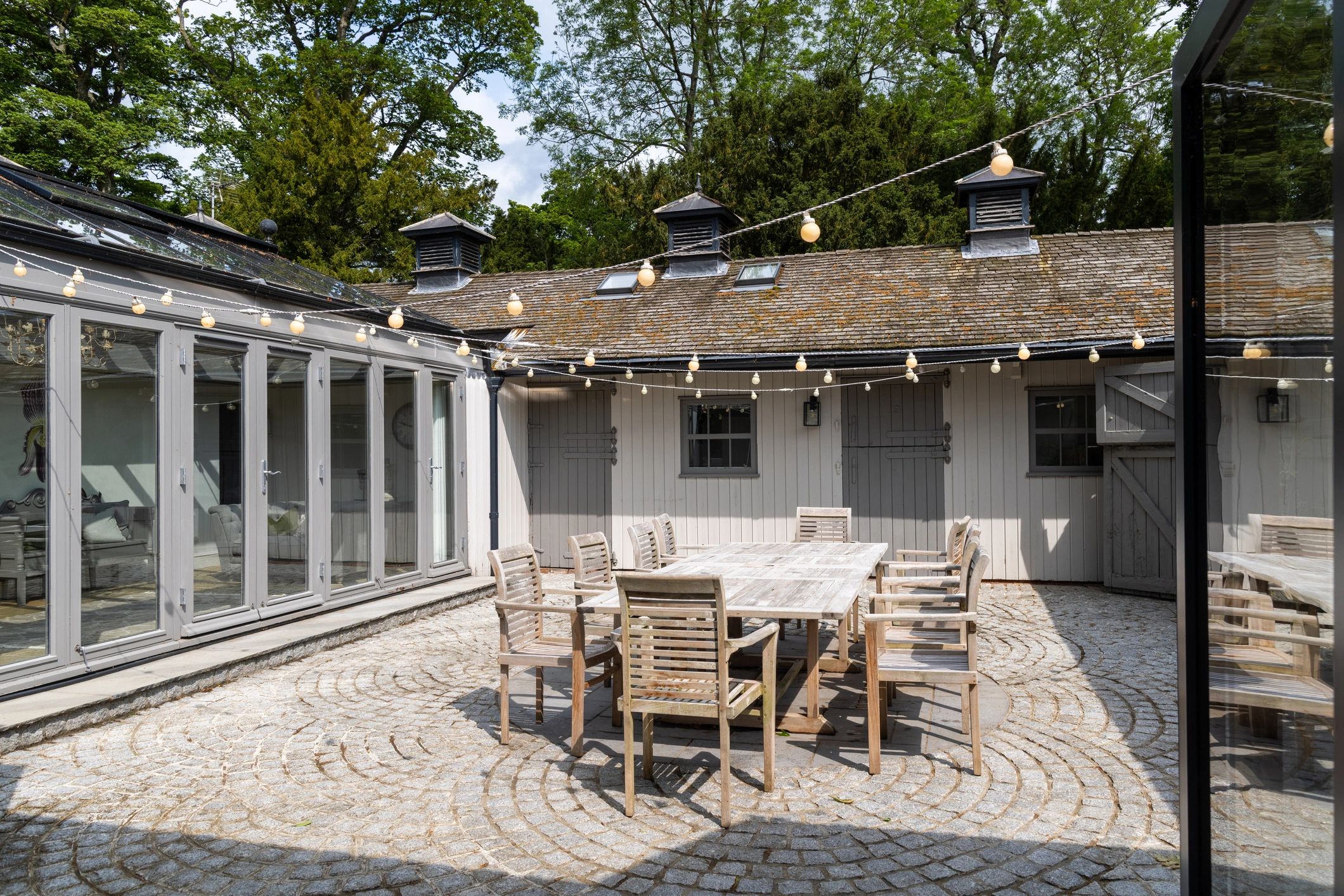 Rustic outdoor table set in a garden courtyard